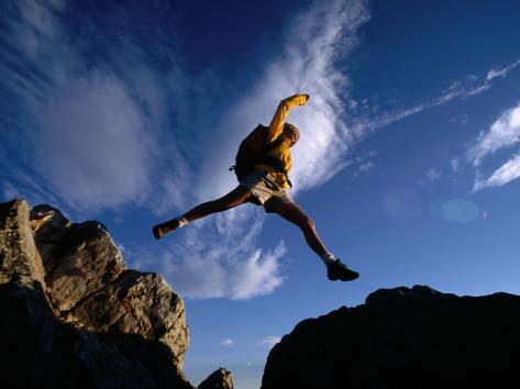 cheyenne-rouse-hiker-jumping-between-roc