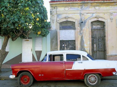 Old American Car Parked on Street Beneath Fruit Tree Cienfuegos Cuba 