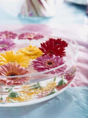a bowl of flowers floating in water table decoration a bowl of flowers floating in water table decoration