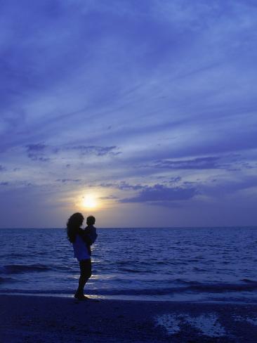 mother and child silhouette on beach mother and child silhouette on beach