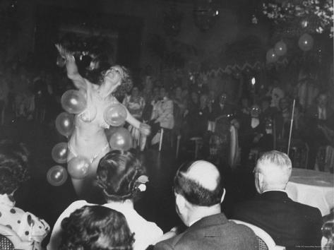 peter-stackpole-semi-nude-bubble-dancer-in-front-of-an-audience-of-tailors-and-their-wives.jpg