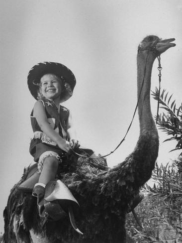 george-skadding-child-riding-ostrich-like-a-horse.jpg