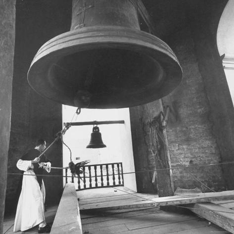 Monk Ringing Bell in Plaza de Armas Photographic Print