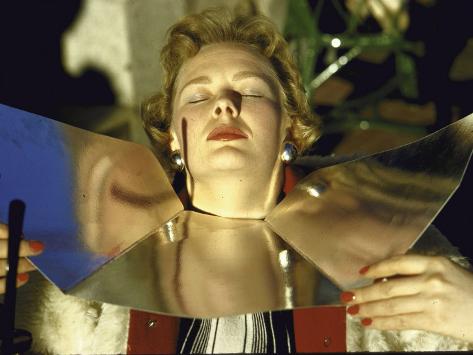 loomis-dean-woman-with-metal-reflector-sunbathing.jpg