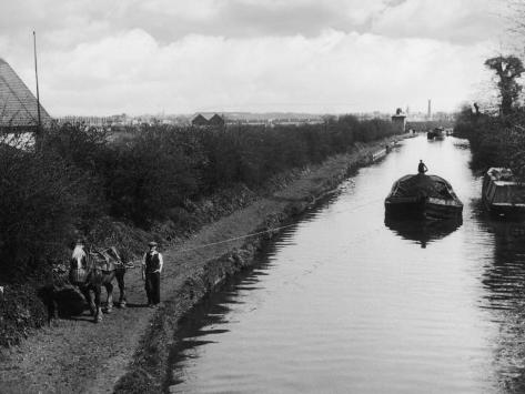 horse-pulls-a-barge-full-of-coal-along-the-canal-towpath.jpg
