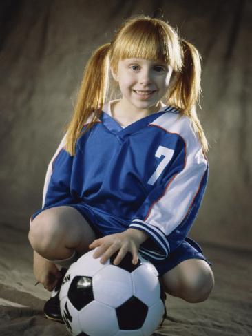 Portrait of a Girl Squatting in Front of a Soccer Ball Photographic Print