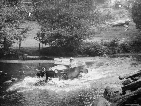 1925 Lancia Lambda Driving Through a Shallow River Photographic Print