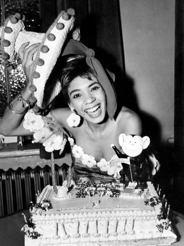 http://imgc.allpostersimages.com/images/P-473-488-90/30/3008/C95BF00Z/posters/cardiff-born-singer-shirley-bassey-pictured-celebrating-her-19th-birthday-with-a-cake.jpg