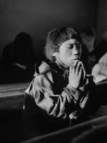 young-eskimo-boy-attending-church-praying-during-church-services.jpg