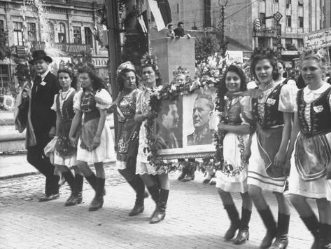 marchers-wearing-creative-costumes-in-the-may-day-parade-carrying-poster-for-tito-and-stalin.jpg