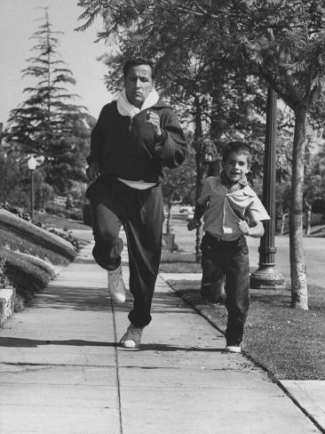 ralph-crane-tennis-player-pancho-segura-running-with-his-younger-son.jpg