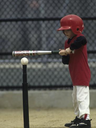 [Image: young-boy-batting-during-a-tee-ball-game.jpg]