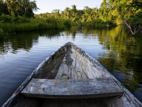 Front of a Dugout Canoe in Calm Water in Peru's Rain Forest