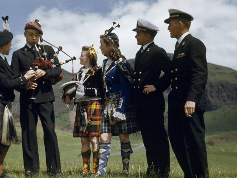 American Cadet Plays a Bagpipe as Bemused Highland Dancers Listen Photographic Print