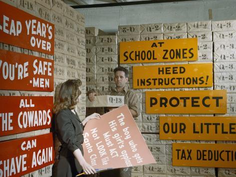 Man and Woman Stand in Warehouse for Rhyming Burma-Shave Signs Photographic Print