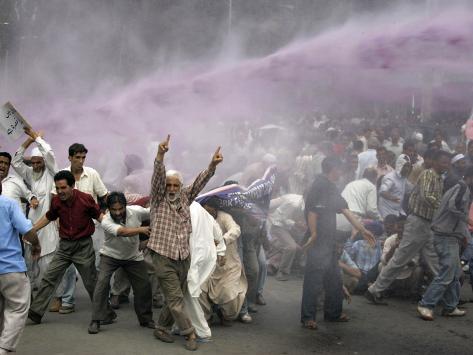 Kashmiri Transporters Shout Amidst Tear Gas Smoke and Colored Water at a Protest in Srinagar, India Photographic Print