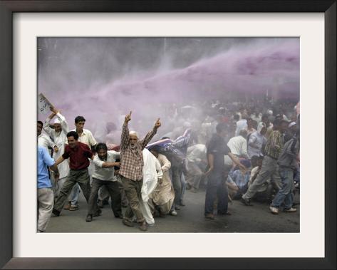 Kashmiri Transporters Shout Amidst Tear Gas Smoke and Colored Water at a Protest in Srinagar, India Framed Photographic Print