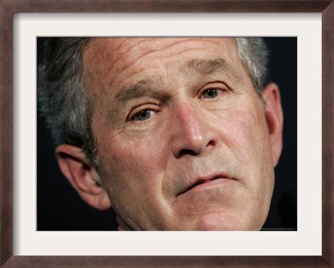 President Bush Listens to a Question About His Declassifying an Intelligence Report Framed Photographic Print