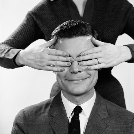 h-armstrong-roberts-woman-using-hands-to-cover-eyes-of-smiling-man.jpg
