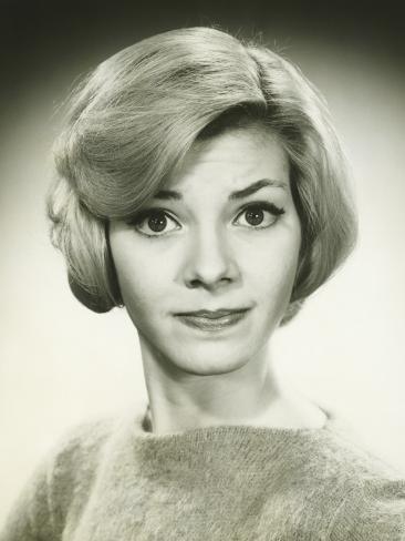 Young Woman With Pursed Lips Posing in Studio Portrait Photographic Print