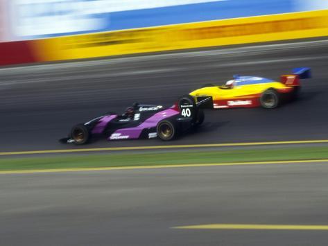 Auto Racing Trophies on Blurred Auto Racing Action Photographic Print At Allposters Com