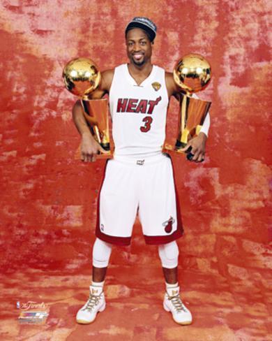 dwyane-wade-with-his-two-nba-championship-trophies.jpg