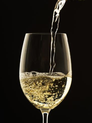 john-hay-white-wine-pouring-from-bottle-into-glass.jpg