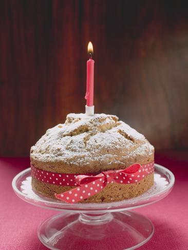 Birthday Cake with Red Bow and Burning Candle Photographic ...