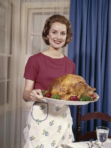 1960s-woman-serving-thanksgiving-turkey-dinner.jpg