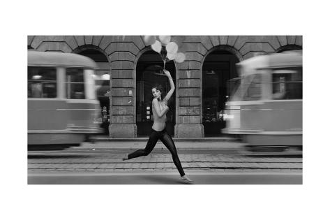 http://imgc.allpostersimages.com/images/P-473-488-90/81/8155/YU7C300Z/posters/conrado-fine-art-photo-young-woman-holding-balloons-in-a-empty-city-street.jpg