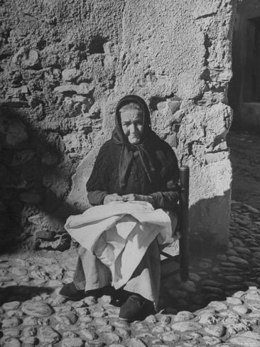 george-rodger-old-woman-sewing-in-the-sun.jpg