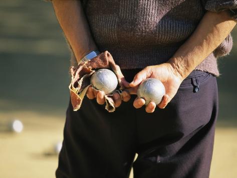 michael-melford-a-man-holding-two-balls-waiting-his-turn-to-play-bocci.jpg
