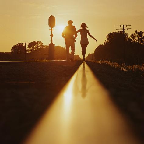 https://imgc.allpostersimages.com/images/P-473-488-90/49/4913/5TJ9G00Z/posters/dennis-hallinan-silhouette-of-couple-walking-on-railroad-tracks-at-sunset.jpg