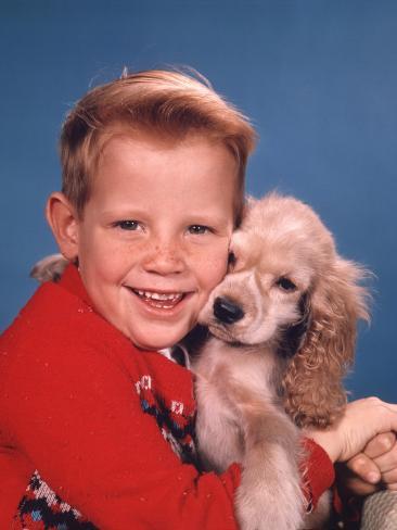 Portrait of Little Boy Hugging His Cocker Spaniel Puppy Photographic Print