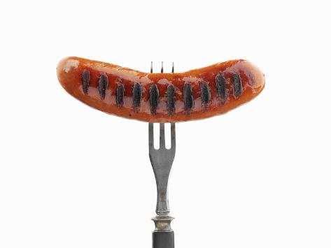pepe-nilsson-grilled-sausage-on-fork.jpg