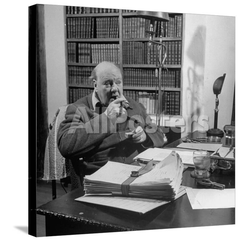 British Leader Winston Churchill Smoking A Cigar At His Desk