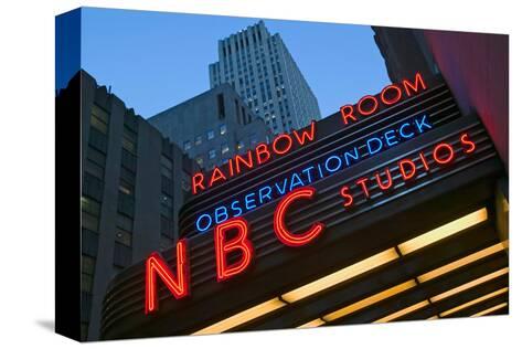 Neon Lights Of Nbc Studios And Rainbow Room At Rockefeller Center New York City New York