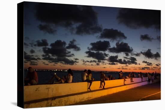 People Sitting on a Wall in Salvador at Dusk-Alex Saberi-Stretched Canvas