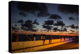 People Sitting on a Wall in Salvador at Dusk-Alex Saberi-Stretched Canvas