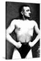 Bodybuilder with Thumbs Tucked in Belt-null-Stretched Canvas