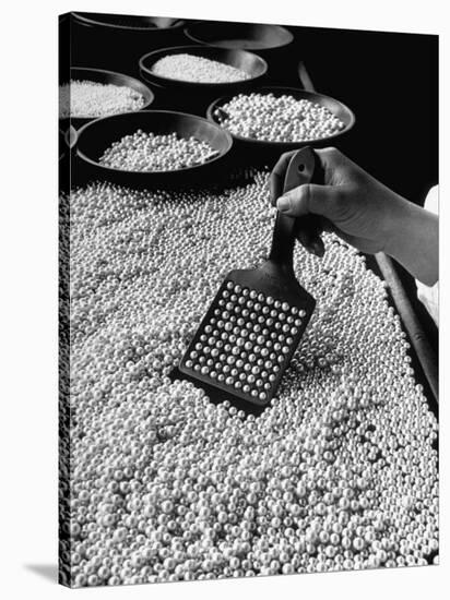 100 Pearls Being Counted at a Time Using Device at Factory-Alfred Eisenstaedt-Stretched Canvas