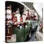 100 Santa Claus in a Special Bus in Paris December, 19, 1966. Colorized Document-null-Stretched Canvas
