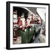 100 Santa Claus in a Special Bus in Paris December, 19, 1966. Colorized Document-null-Framed Photo