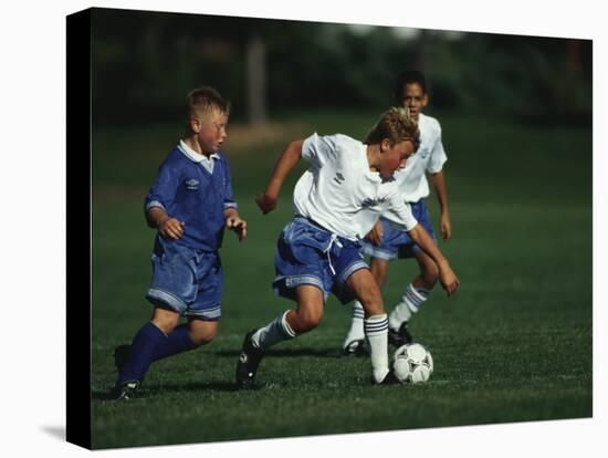 11 Year Old Boys Soccer Action-null-Stretched Canvas