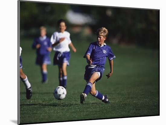 11 Year Old Boys Soccer Action-null-Mounted Photographic Print