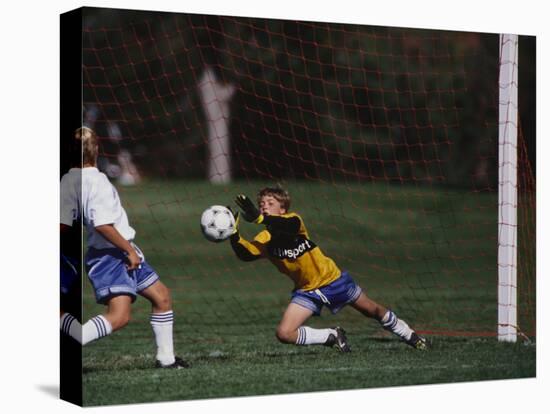 11 Year Old Boys Soccer Goalie in Action-null-Stretched Canvas