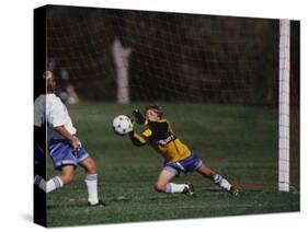 11 Year Old Boys Soccer Goalie in Action-null-Stretched Canvas