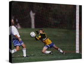 11 Year Old Boys Soccer Goalie in Action-null-Stretched Canvas