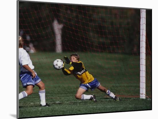 11 Year Old Boys Soccer Goalie in Action-null-Mounted Photographic Print