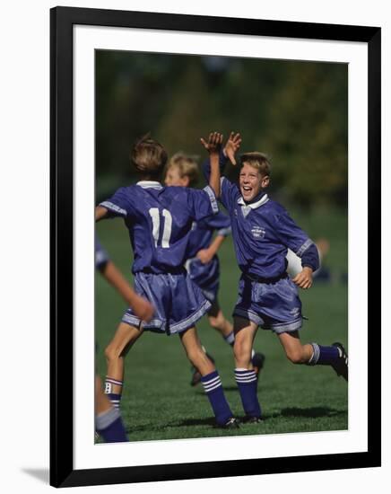 11 Year Old Boys Soccer Player Celebates a Goal-null-Framed Photographic Print